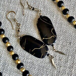 Black and gold necklace and earrings